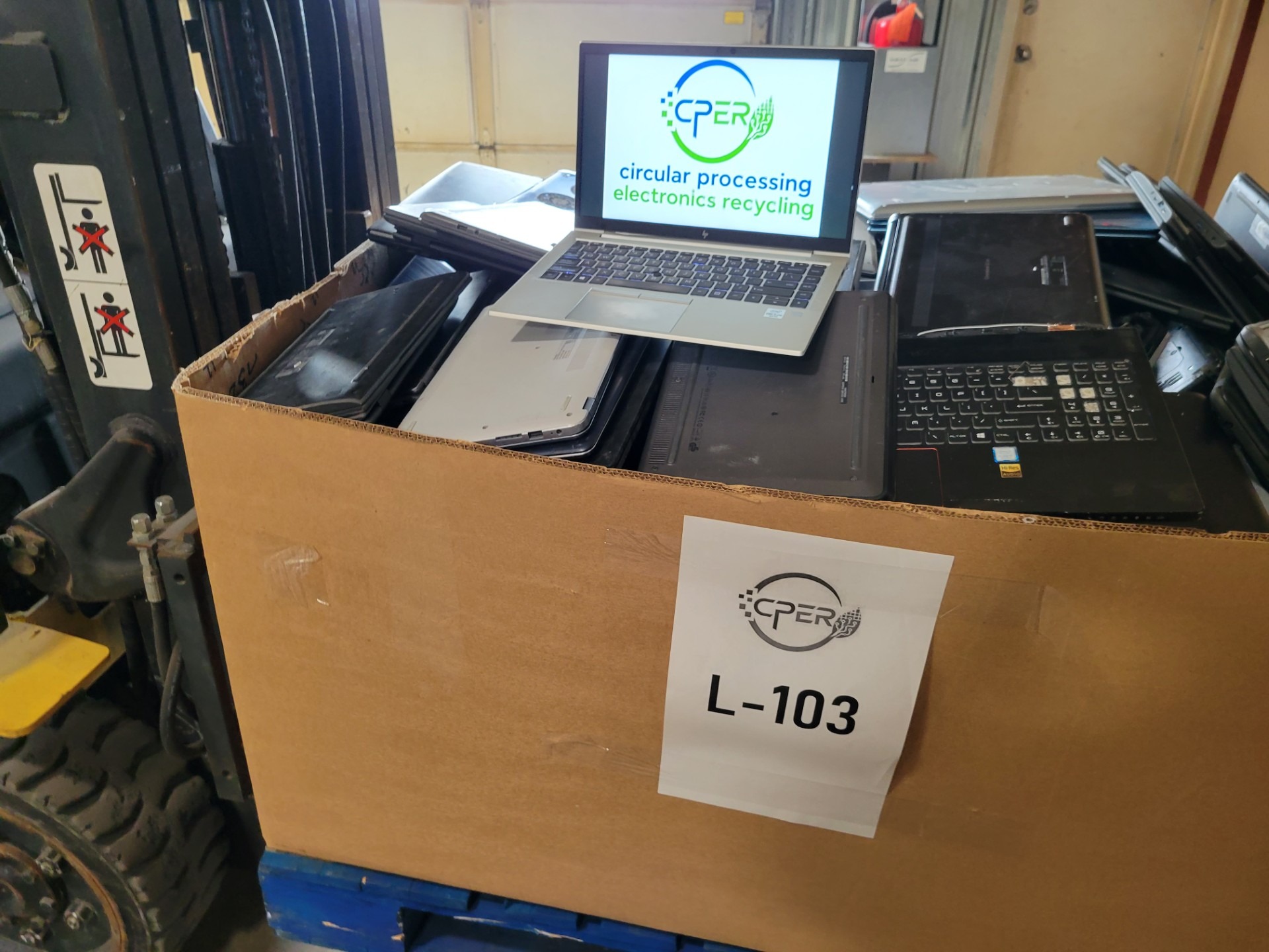 Pallet of laptops collected by CPER for reuse, refurbishment and recycling